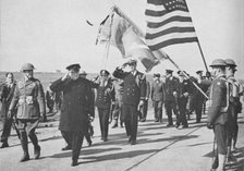 'Iceland visit. Churchill - with Ensign Franklin D. Roosevelt Jnr. following - saluting the Stars an