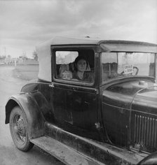 During the cotton strike, a striking picker applies for an emergency food grant, Shafter, CA, 1938. Creator: Dorothea Lange.