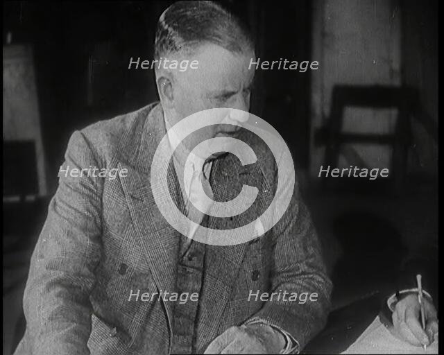 Charles B Cochran Sitting at a Table, 1920s. Creator: British Pathe Ltd.
