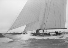 The cutter 'Minstrel' competing in the round Island Race, 1938. Creator: Kirk & Sons of Cowes.