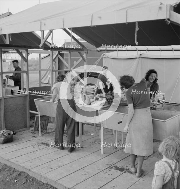 Portable laundry unit, shower unit beyond, FSA camp, Merrill, Oregon, 1939. Creator: Dorothea Lange.