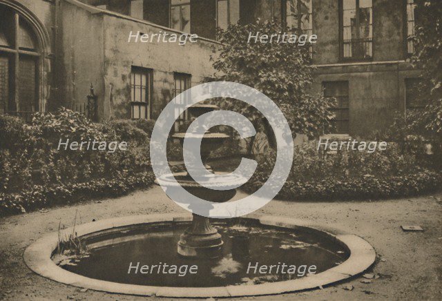 'Ancient Mulberry Tree and Fountain in the Garden of Drapers' Hall', c1935. Creator: Joel.