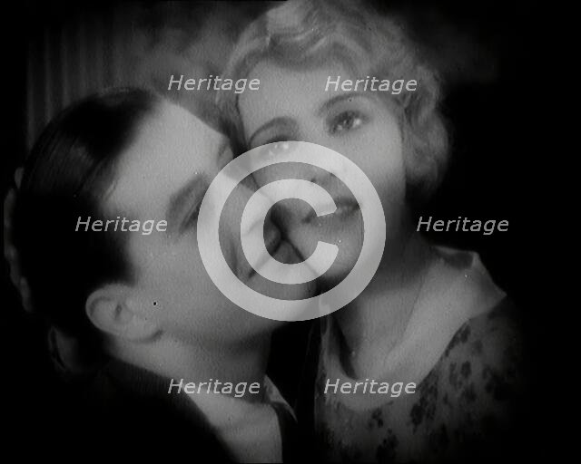 The Actor Ray Milland Embracing a Female British Actor, 1920s. Creator: British Pathe Ltd.