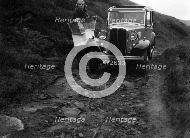 Kitty Brunell road testing a Standard Little Twelve saloon, c1932. Artist: Bill Brunell.