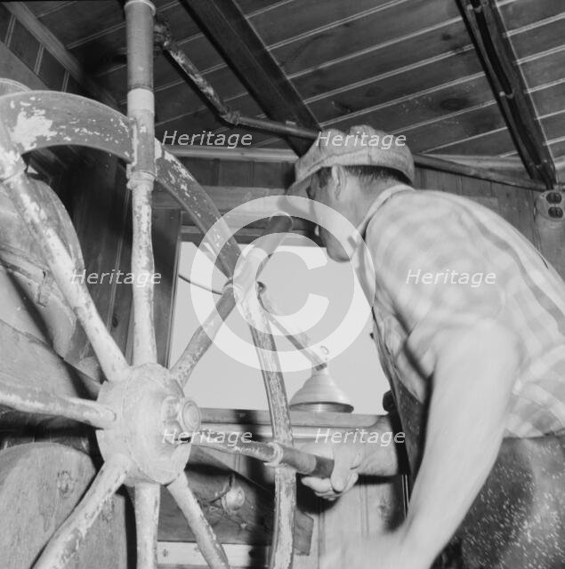 Scene in a pilot house during a mackeral school chase, Gloucester, Massachusetts, 1943. Creator: Gordon Parks.