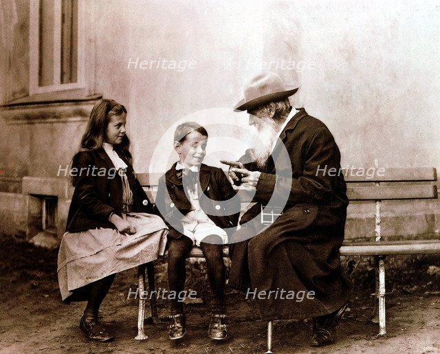 Leo Tolstoy, Russian writer, philosopher and mystic, telling his grandchildren a story, c1890-1910. Artist: Unknown