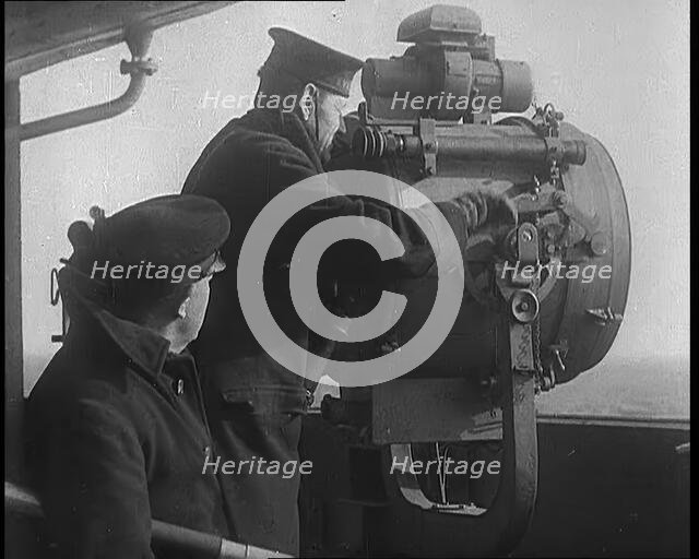British Royal Navy Officer Looking Through a Telescope With a Searchlight at  the Norwegian..., 1940 Creator: British Pathe Ltd.