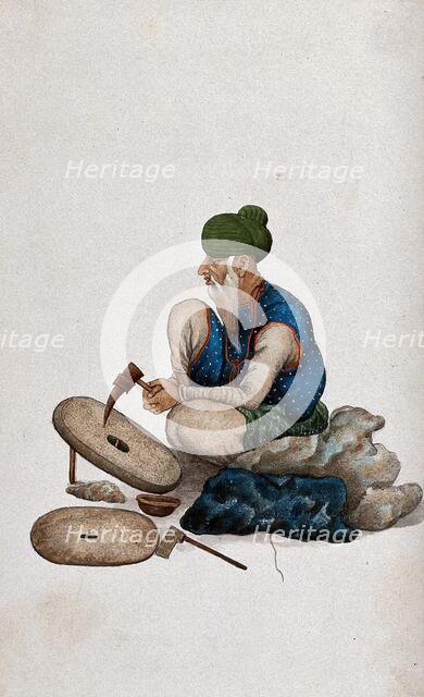 A man making grindstones, (between 1800 and 1899?). Creator: Unknown.