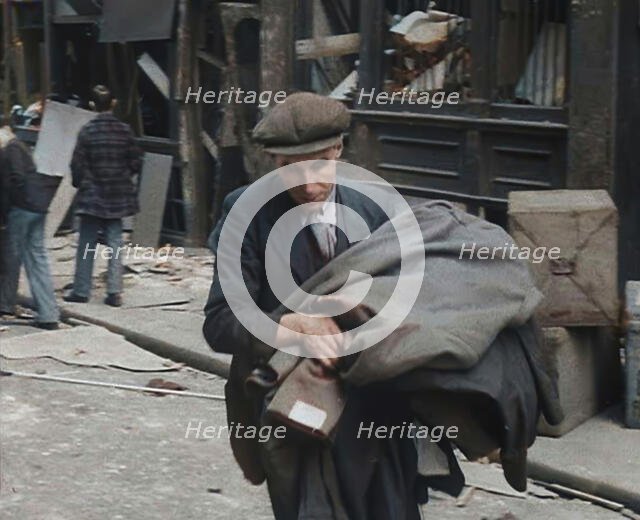 A Man Carrying His Possessions Away, 1940. Creator: British Pathe Ltd.