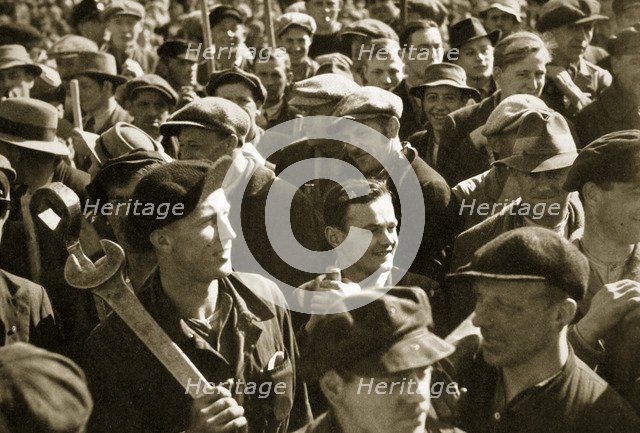 Factory workers with their tools celebrate the traditional Socialist holiday, Germany, 1936. Artist: Unknown