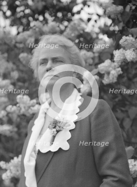Noland, Charlotte, Miss, standing outdoors, 1931 May 8. Creator: Arnold Genthe.
