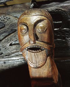Fierce human mask carved on the side of the Oseberg cart, Viking, Norway, c850. Artist: Werner Forman
