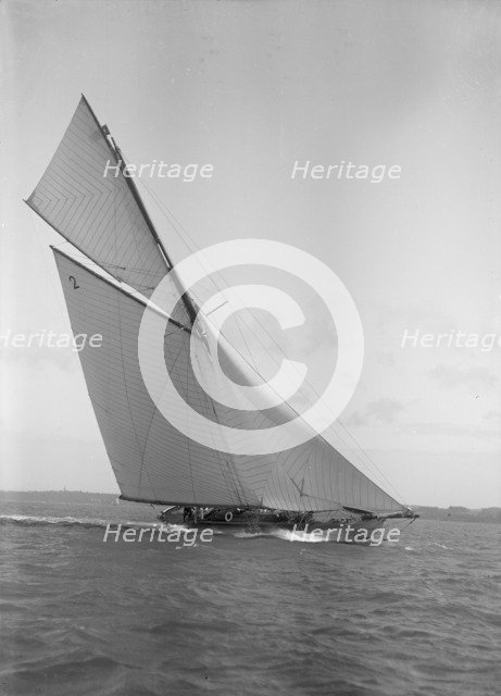 The 40-rater cutter 'Carina' heeling in good wind, 1911. Creator: Kirk & Sons of Cowes.