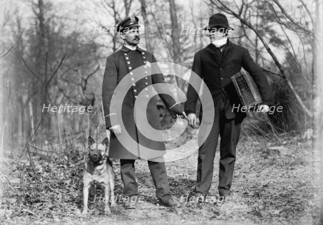 Police dogs, policeman, and thief, New York City, 1912. Creator: Bain News Service.