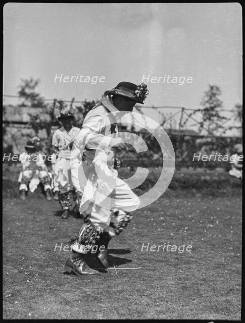 Bampton Morris troupe performing in a 'Pipe Dance', Bampton, West Oxfordshire, Oxfordshire, 1920-30. Creator: George R Long.