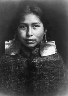 Tsawatenok girl, head-and-shoulders portrait, facing front, c1914. Creator: Edward Sheriff Curtis.