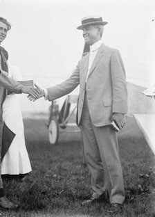 Maj. Edgar Russell, Signal Corps, U.S.A., Right, Shaking Hands with Aviator Wood, 1911. Creator: Harris & Ewing.