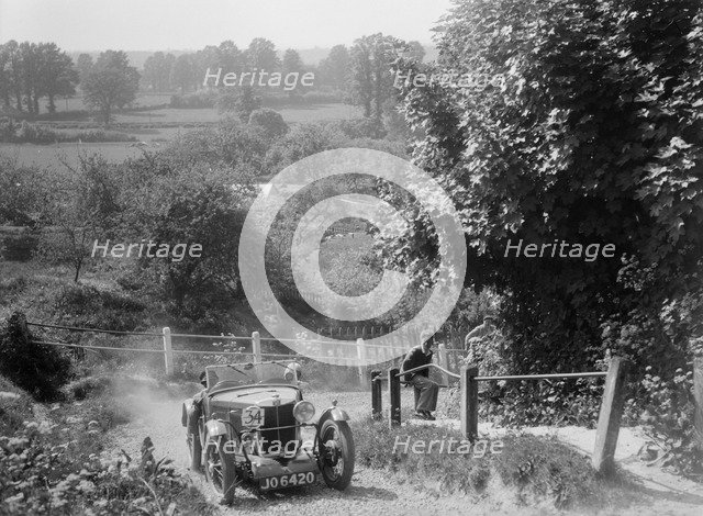 1933 MG J2 Standard taking part in a West Hants Light Car Club Trial, Ibberton Hill, Dorset, 1930s. Artist: Bill Brunell.