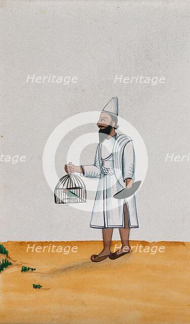 A servant holds a parrot in a cage with one hand while the other is..., (between 1800 and 1899?). Creator: Unknown.