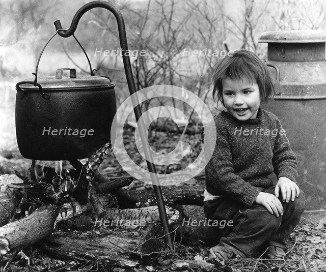 Daphne, gipsy girl, with cooking pot, Charlwood, Surrey, 1964.