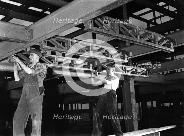 Engineers lifting steelwork into position, South Yorkshire, 1954. Artist: Michael Walters