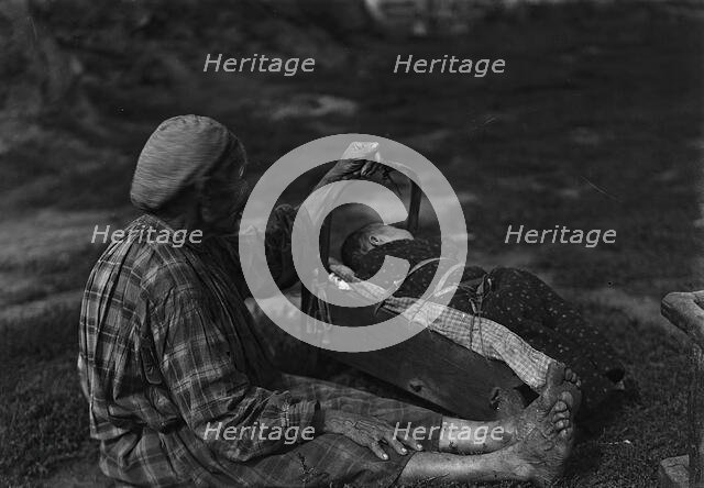 A woman with a cradle, 1890.  Creator: Unknown.