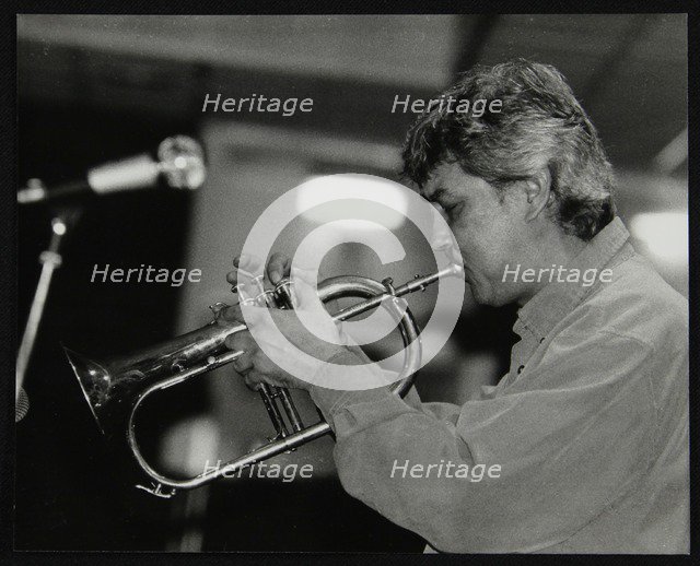 Dick Pearce playing the flugelhorn at The Fairway, Welwyn Garden City, Hertfordshire, 1999. Artist: Denis Williams