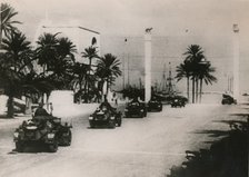 German armoured cars of a Panzer unit drive through Tripolie, West Libya, c.1943.. Artist: Unknown