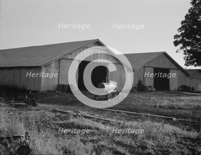 Tractor garage at the Aldridge Plantation near Leland, Mississippi, 1937. Creator: Dorothea Lange.
