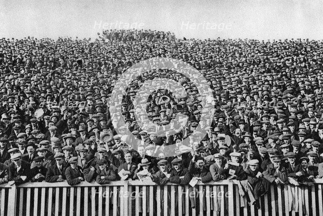 A Saturday winter football crowd, London, 1926-1927. Artist: Unknown