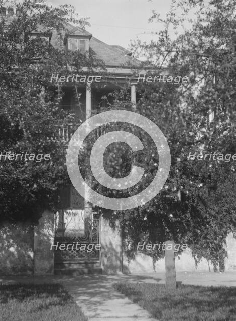 Multi-story house behind trees, [George Eveleigh House, 39 Church Street], Charleston..., c1920-1926 Creator: Arnold Genthe.