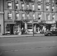 A tenament house in Harlem, New York, 1943. Creator: Gordon Parks.