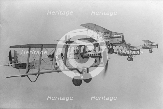 De Havilland DH9 aeroplanes flying in formation, 1923. Artist: Aerofilms.