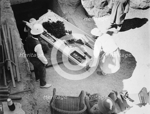 Funeral bouquet being removed from the tomb of Tutankhamun, Valley of the Kings, Egyp, 1922. Artist: Harry Burton