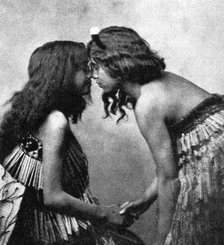 Maori girls rubbing noses, c1920. Artist: Unknown
