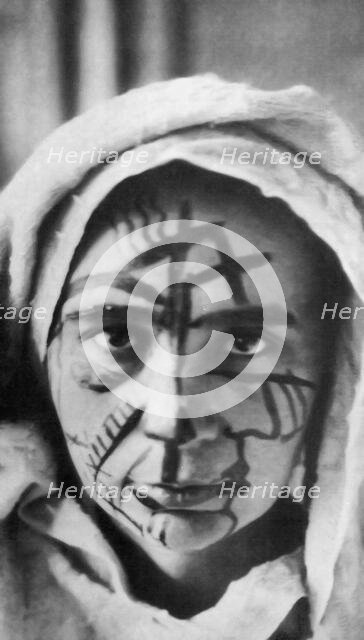 Natalia Goncharova with make-up for the futurist theater, 1913. Creator: Anonymous.