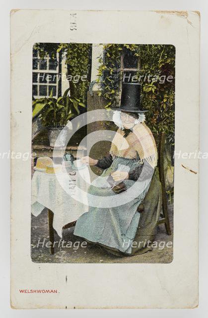 A Welsh woman at tea table with knitting on her lap, c1900. Creator: Unknown.