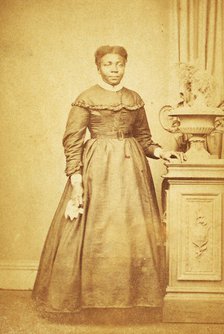 Studio portrait of unidentified  woman holding handkerchief, c1860-c1869. Creator: Sims Photograph Gallery.
