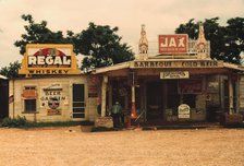A cross roads store, bar, "juke joint," and gas...in the cotton plantation area, Melrose, La., 1940. Creator: Marion Post Wolcott.