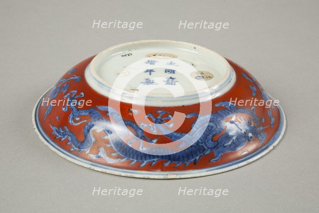 Red clobbered blue and white saucer with stork, phoenix and dragons, Jiajing (1522-1566). Artist: Unknown.