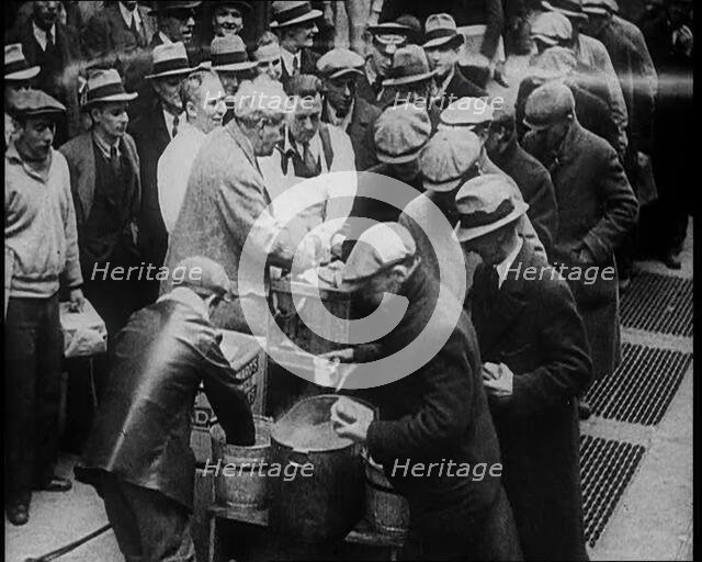 Men Getting Soup from a Soup Kitchen, 1933. Creator: British Pathe Ltd.