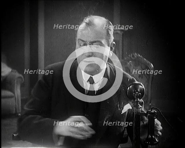 The Producer Julian Wylie Speaking on a Telephone, 1920s. Creator: British Pathe Ltd.