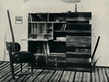 'Bookcase and Chair. Designed and executed by Hans Hartl', c1927. Artist: Unknown.