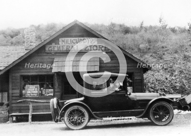 1916 Cadillac V8 car, parked outside a general store, USA, (c1916?). Artist: Unknown
