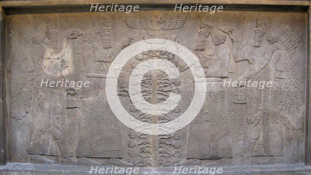Relief with two figures of Ashurnasirpal, winged mythological beings and the god Ashur, before the Tree of Life, 885-860 BC. Artist: Assyrian Art  