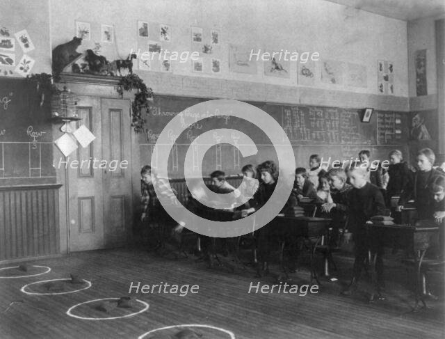 Washington, D.C. public schools - 3rd Division children tossing bean bags in ring, (1899?). Creator: Frances Benjamin Johnston.