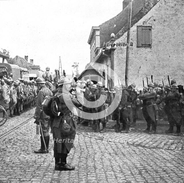 Operations in Flanders; Belgian troops pay honour to the flag of a French regiment..., 1917. Creator: Unknown.