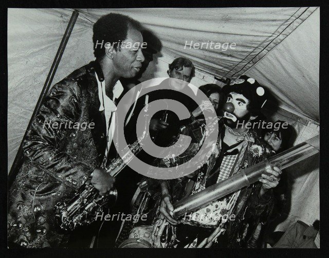 American saxophonist Ornette Coleman meets a clown, Bracknell Jazz Festival, Berkshire, 1978. Artist: Denis Williams