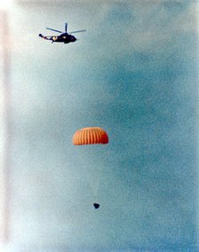 Gemini 12 descends for splashdown, 1966. Creator: NASA.