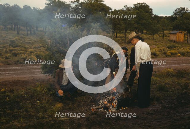 Men in front of outdoor fire, Pie Town Fair, New Mexico, 1940. Creator: Russell Lee.